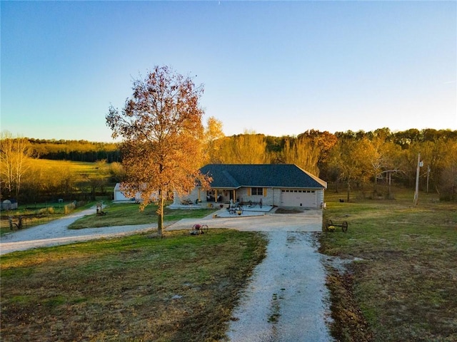 view of front of home with a garage and a front lawn