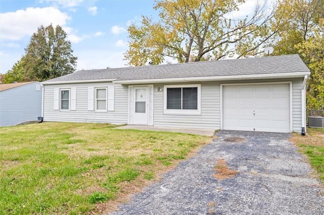 single story home featuring central air condition unit, a garage, and a front lawn