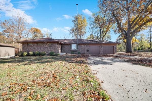 single story home with a garage