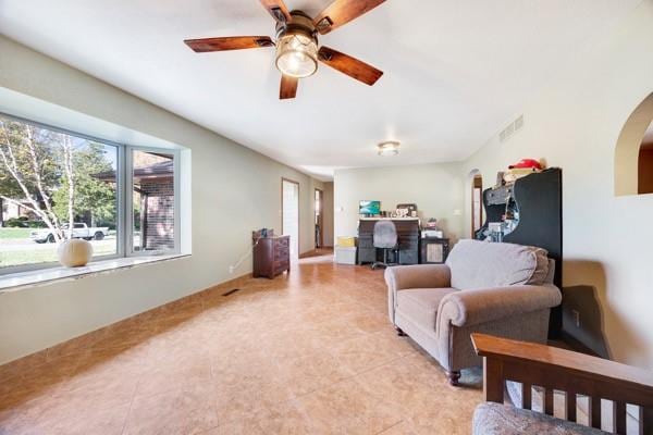 living room featuring ceiling fan