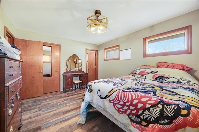 bedroom with hardwood / wood-style flooring