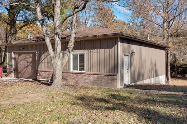 view of side of property featuring a garage