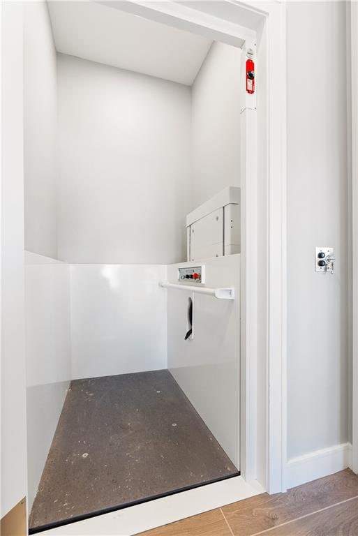 bathroom with wood-type flooring