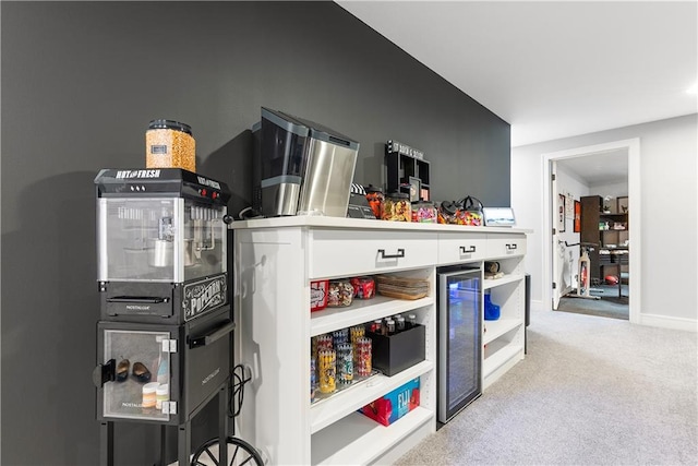 interior space featuring white cabinetry and light colored carpet