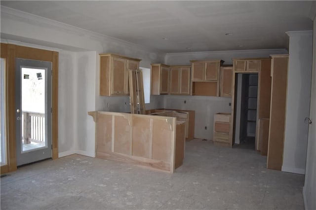 kitchen featuring a peninsula, light brown cabinetry, and ornamental molding