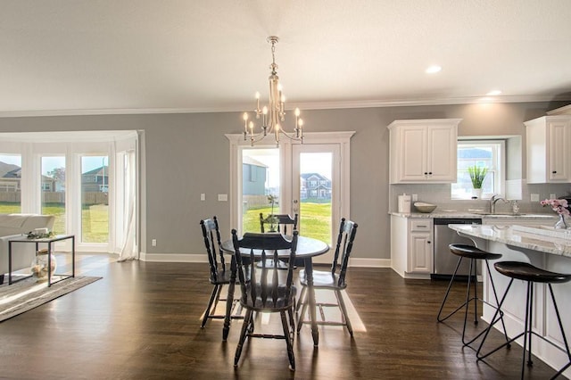 dining room featuring dark wood-type flooring, french doors, baseboards, and ornamental molding