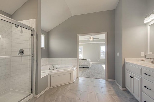 ensuite bathroom with a shower stall, a garden tub, vaulted ceiling, ensuite bathroom, and vanity