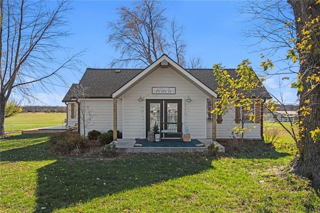 bungalow-style house featuring a front lawn