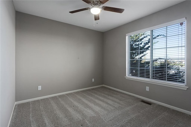 carpeted empty room with ceiling fan