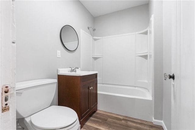 full bathroom featuring wood-type flooring, vanity, toilet, and shower / washtub combination