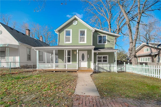 view of front facade with a front yard and a porch