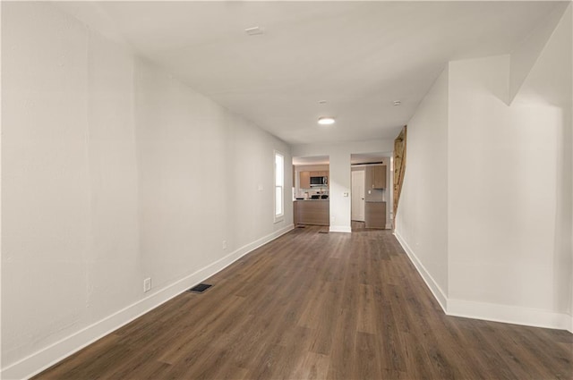 corridor with dark wood-type flooring