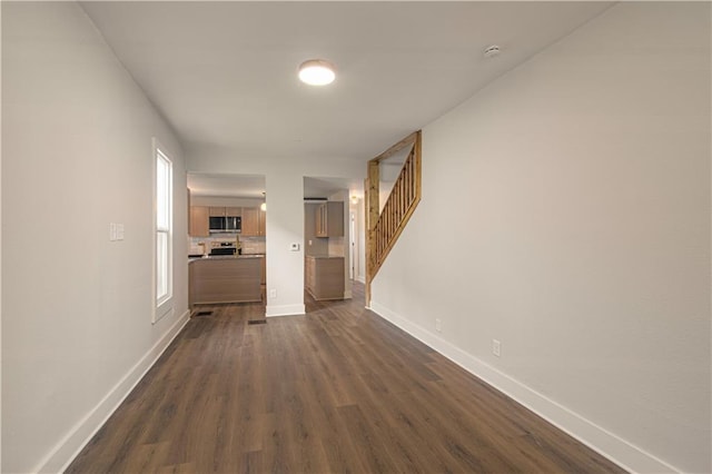 hall with dark hardwood / wood-style floors