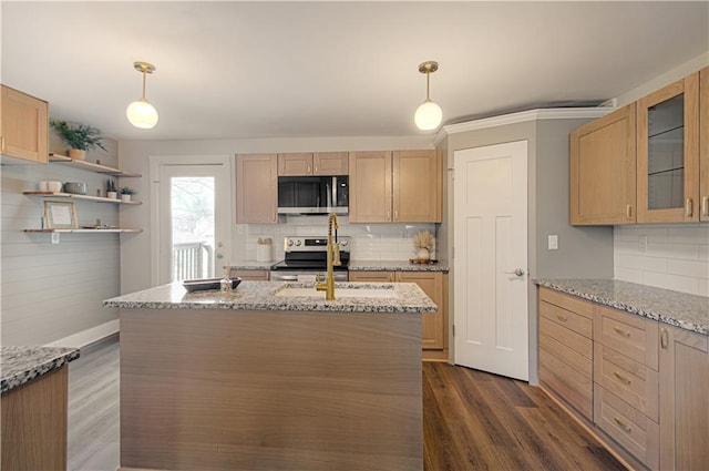 kitchen with light stone countertops, light brown cabinetry, stainless steel appliances, and decorative light fixtures