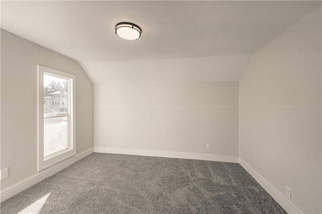 bonus room featuring carpet and lofted ceiling