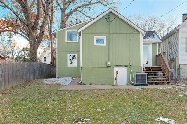 view of outbuilding featuring a yard and central AC unit