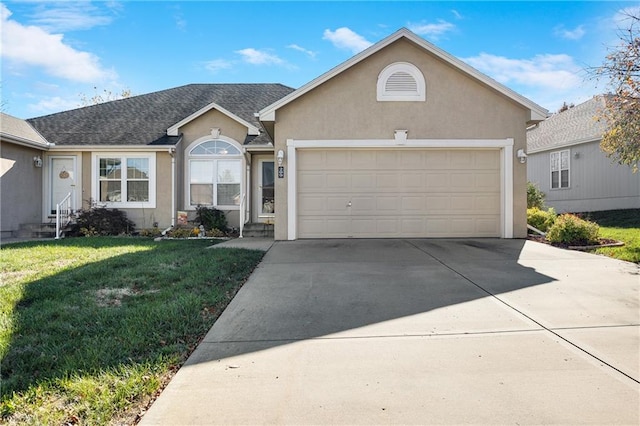 view of front of property with a garage and a front lawn