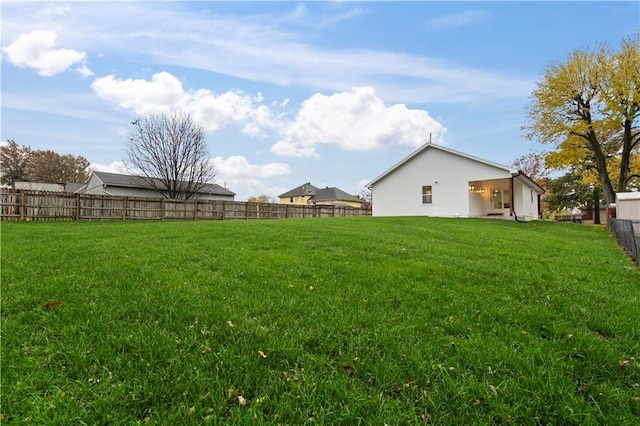 view of yard with a fenced backyard