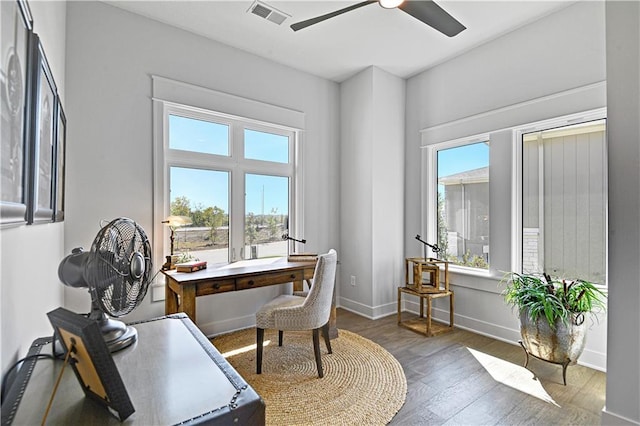 office with dark hardwood / wood-style flooring and ceiling fan