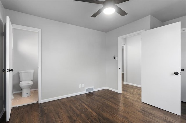 bedroom featuring connected bathroom, ceiling fan, and dark hardwood / wood-style floors