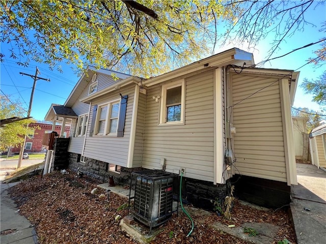 view of home's exterior with cooling unit