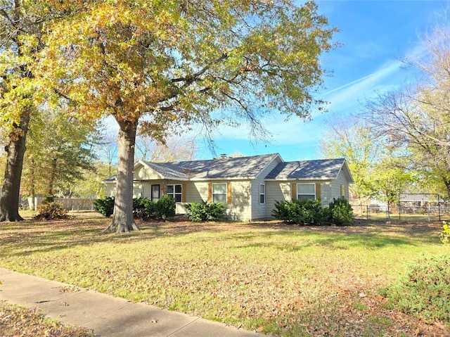 ranch-style home with a front yard