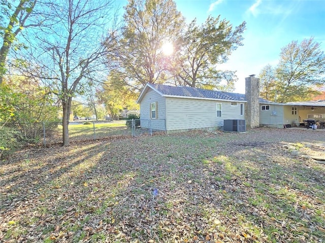 rear view of property featuring central air condition unit