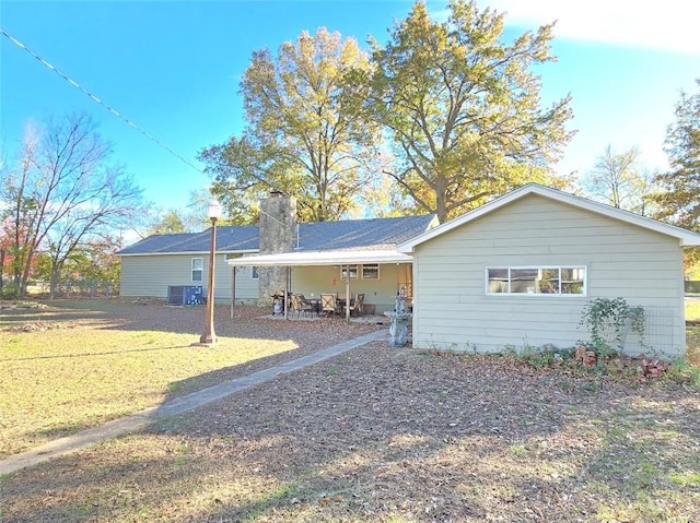 single story home featuring a front yard and cooling unit