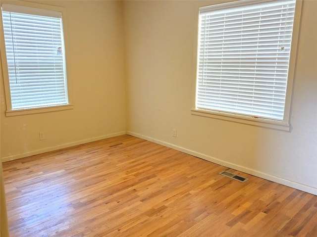 empty room with light wood-type flooring