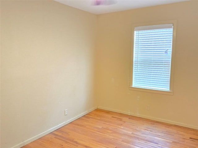 empty room with light hardwood / wood-style flooring