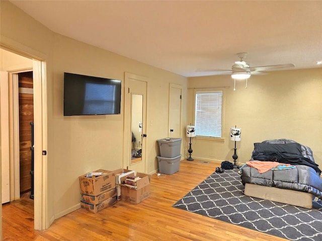 bedroom featuring ceiling fan and hardwood / wood-style floors