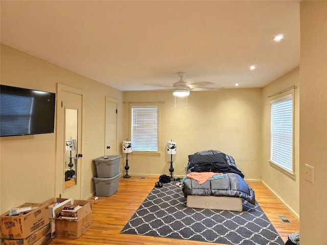 bedroom featuring ceiling fan and light hardwood / wood-style flooring