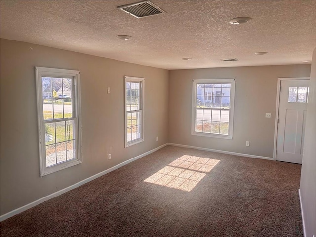 interior space featuring a textured ceiling