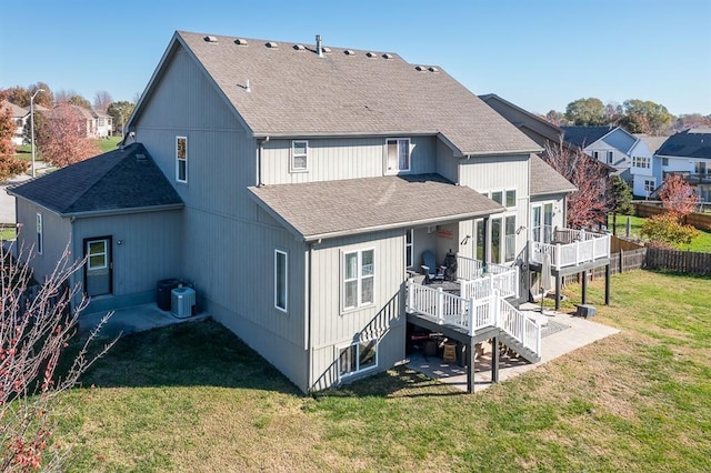 back of property with a patio, a lawn, cooling unit, and a wooden deck