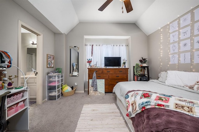 carpeted bedroom with ceiling fan and lofted ceiling