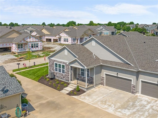 11901 S Tallgrass Dr Unit 702, Olathe, KS 66061 - view of front facade featuring stucco siding, stone siding, a residential view, and a garage