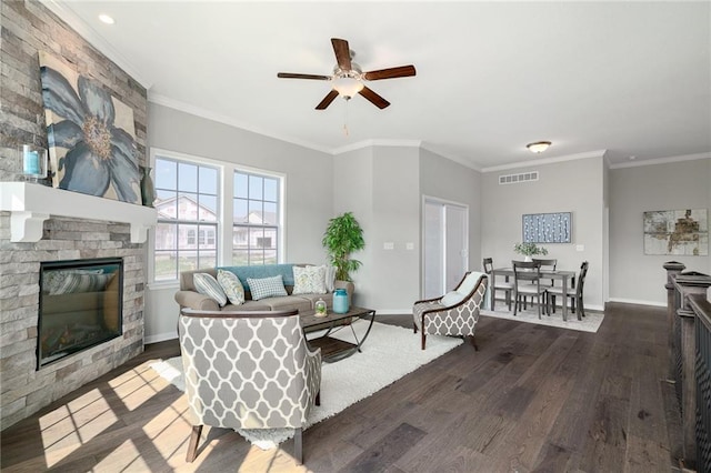 11901 S Tallgrass Dr Unit 702, Olathe, KS 66061 - living area featuring dark wood-type flooring, a fireplace, ceiling fan, baseboards, and ornamental molding
