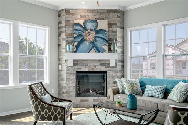11901 S Tallgrass Dr Unit 702, Olathe, KS 66061 - living area with crown molding, wood finished floors, plenty of natural light, baseboards, and a fireplace