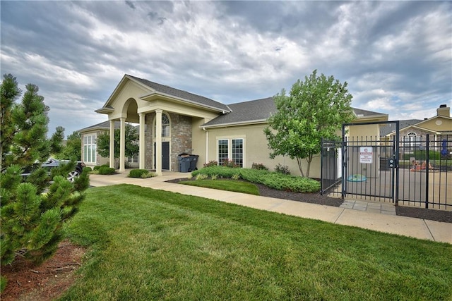 11901 S Tallgrass Dr Unit 702, Olathe, KS 66061 - view of front of house featuring a gate and stucco siding