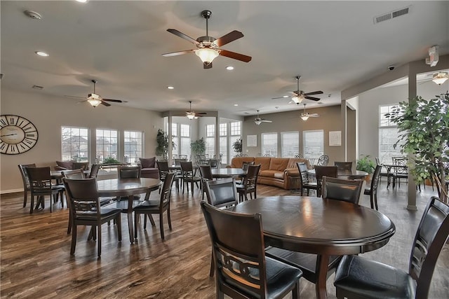 dining space with dark hardwood / wood-style floors and plenty of natural light