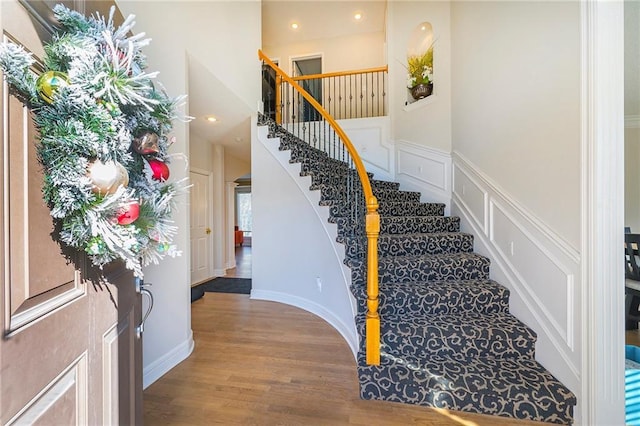 stairs featuring hardwood / wood-style flooring