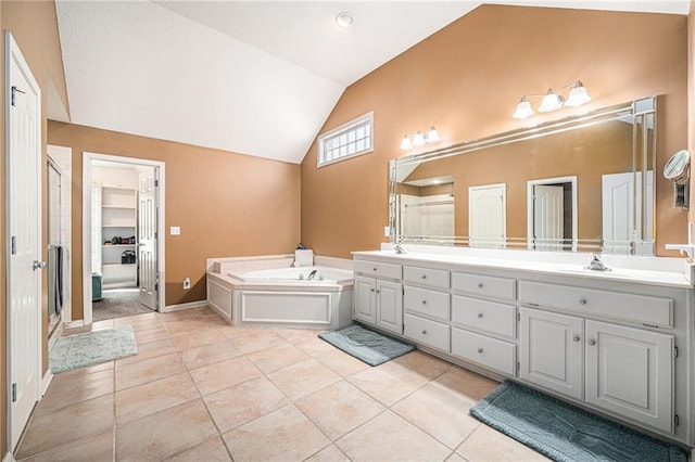 bathroom featuring tile patterned flooring, vanity, independent shower and bath, and vaulted ceiling