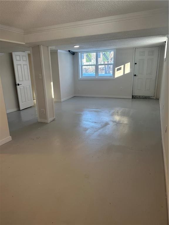 basement with crown molding and a textured ceiling