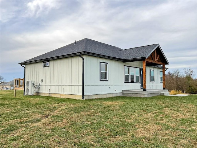 view of side of home featuring a yard