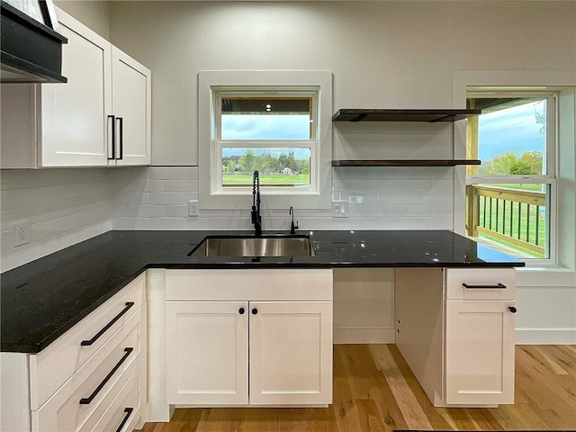 kitchen with plenty of natural light, sink, and white cabinetry