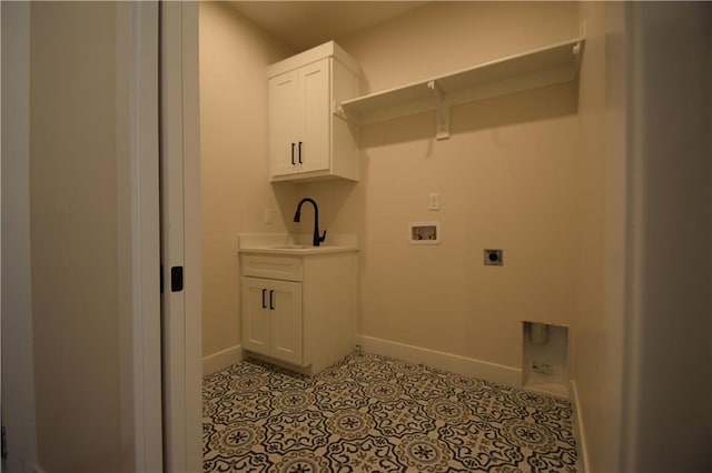 clothes washing area featuring cabinets, washer hookup, hookup for an electric dryer, and light tile patterned floors