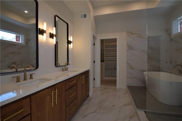 bathroom featuring vanity and tiled shower