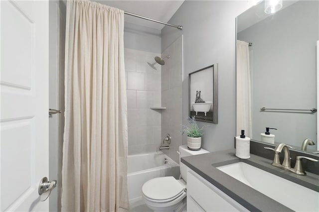 full bathroom with vanity, shower / bath combination with curtain, and toilet