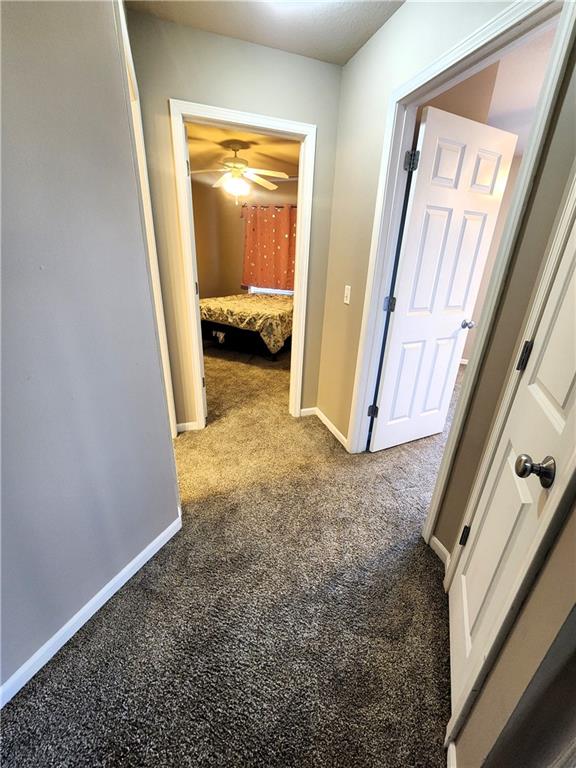 corridor with carpet floors