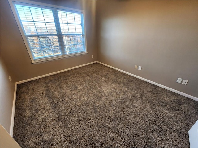 spare room featuring carpet